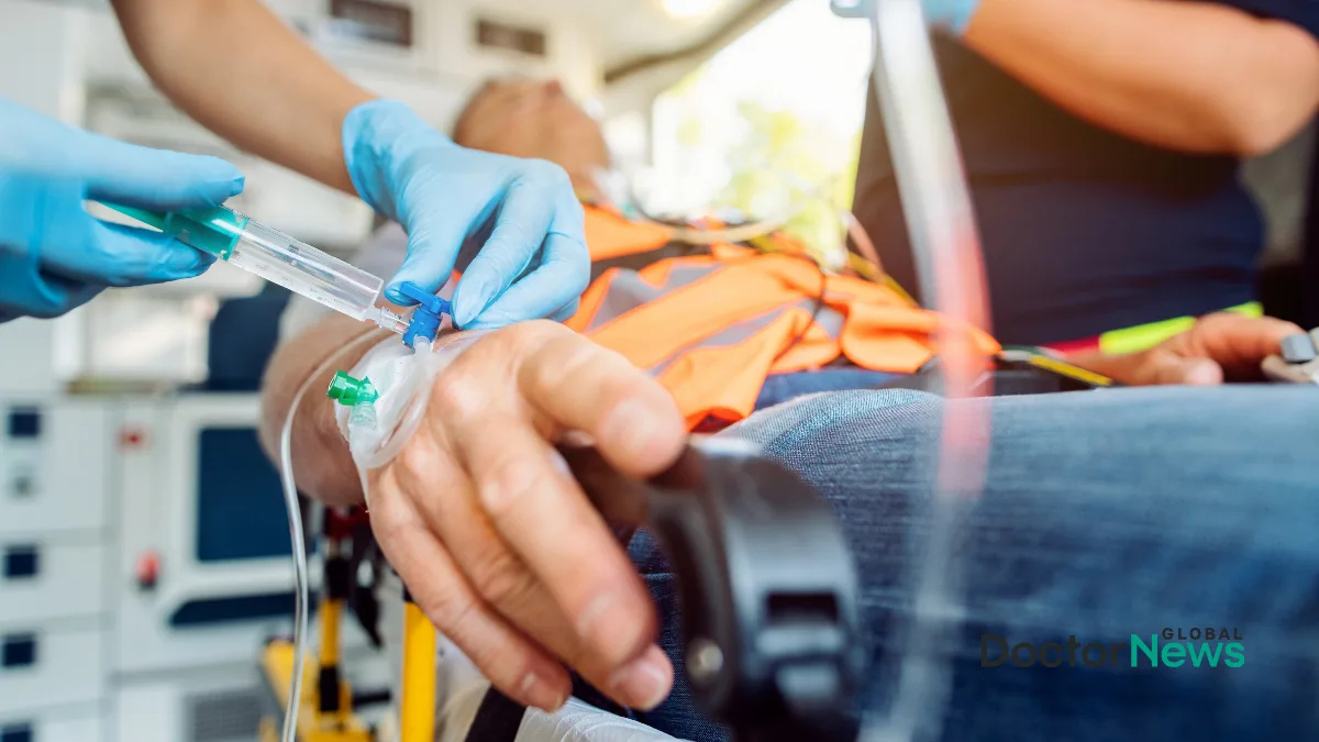 A clinician placing an intravenous line in a patients hand